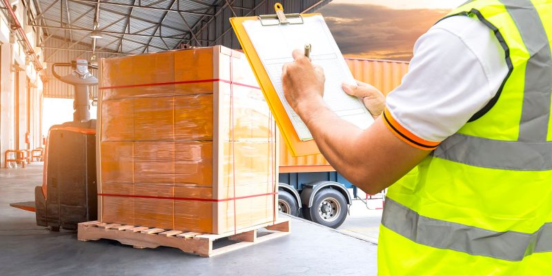 Workers Holding Clipboard is Checking Stock of Package Boxes. Storage Warehouse. Inventory Management Supplies. Supply Chain. Shipment Goods Shipping Warehouse Logistics.